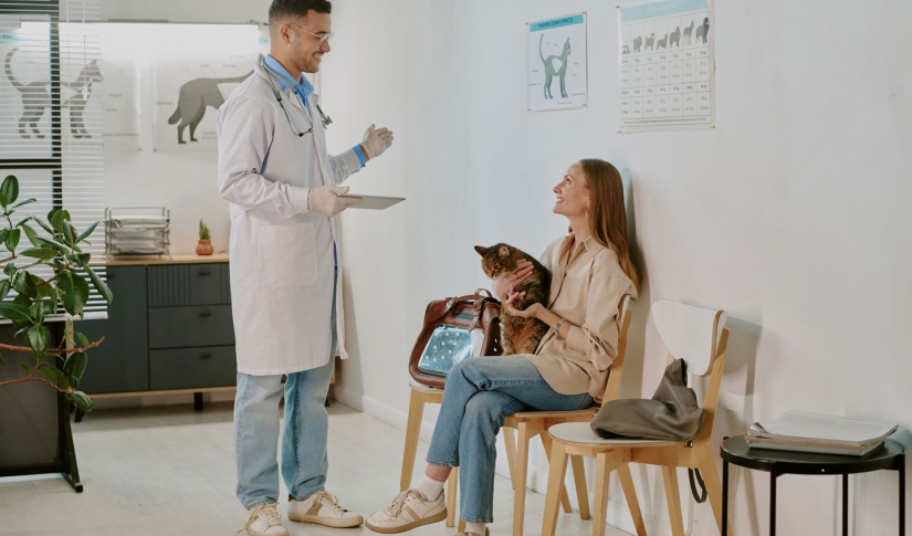 Vet talking to pet owner